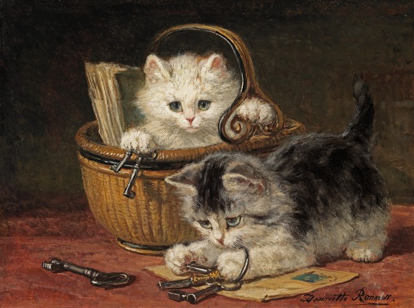 Two kittens playing with keys by a wicker basket