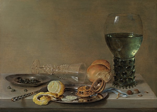A still life of a rummer of white wine, a mother-of-pearl inlaid knife, a gilt-brass clockwatch with a blue ribbon, a pewter plate with capers, a peeled lemon and a façon-de-Venise wineglass on a table