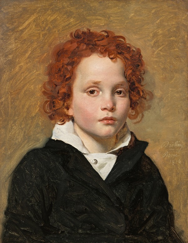 Portrait of a young boy with red hair