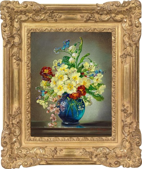 Bouquet of spring flowers in a blue vase